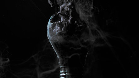 Ink water drop. Smog cloud. Night horror ghost. Gray vapor blast in broken light bulb on dark black grunge grain texture abstract art background.の写真素材