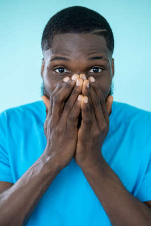 Shocked man. Omg face. Wow portrait. Unexpected surprise. Astonished speechless guy covering mouth...