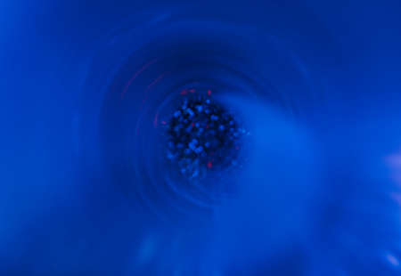 Blur neon glow. Futuristic background. Cyber illumination. Defocused fluorescent navy blue pink...