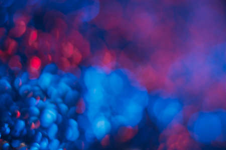 Bokeh light overlay. Blur neon flare. Fluorescent bubbles. Defocused LED blue red color circles glow...