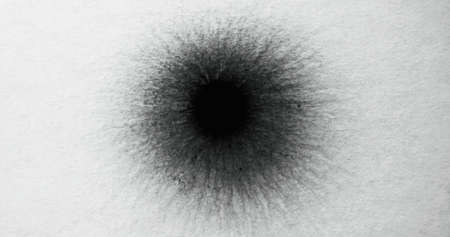 Black paint drop on white paper. Pencil dot stain. Frayed edge texture. Ink splash mark on rough...