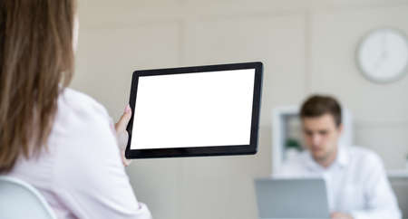 Digital technology. Office work. Computer mockup. Unrecognizable woman holding tablet computer blank...