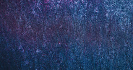 Sparkling background. Glitter particles texture. Shiny grain pattern. Neon blue pink color gradient...