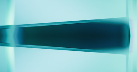 Luminous abstract background. Blur neon light. Bokeh glow. Defocused verdigris green teal blue color radiance futuristic geometric copy space wallpaper.の写真素材