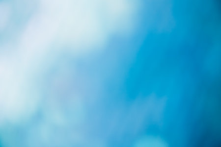 Blur light flare. Bokeh glow. Sky clouds rays. Defocused blue white color gradient beam texture...