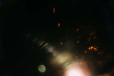 Blurred glow. Dark art background. Colored optical lens flare. Abstract design.の写真素材