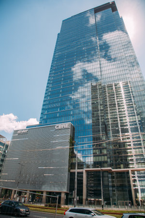 Warsaw, Poland - June 27, 2022: Administrative architecture. Health service. Modern city. High buildings of innovative clinic Stryker in sunny daylight.のeditorial素材