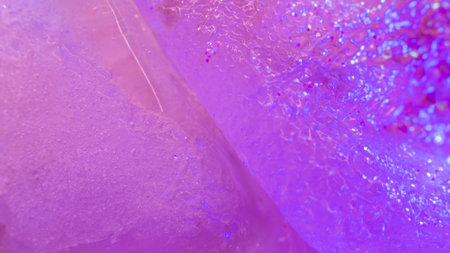 Permafrost bacteria. Melting glacier. Creative ice background with sparkling infusions. Macro texture shotの写真素材