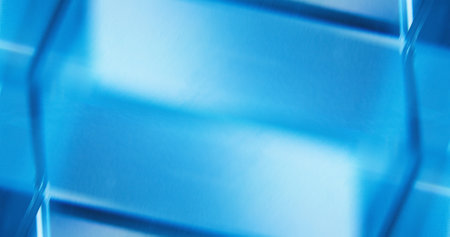 Defocused neon light. Glowing background for text. Fluorescent illumination. Blur tranquil blue white color reflection geometric abstract empty space wallpaper.の写真素材