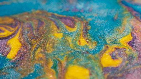 Painting relax. Fluid magic. Creative art. Blue yellow purple fluid paint blend