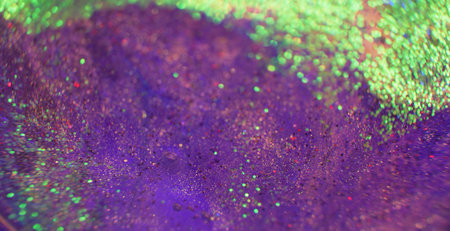Bokeh light background. Glitter texture. Firework sparks. Defocused neon purple green color shimmering circles on bright grain surface.の写真素材