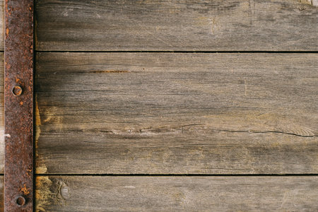 Wooden texture. Vintage gate. Brown background. Rustic old surface with scratches cracks and metal...