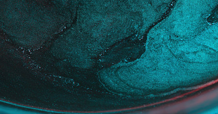 Color glitter abstract background. Blur particles. Marble texture. Defocused cyan blue red shiny...