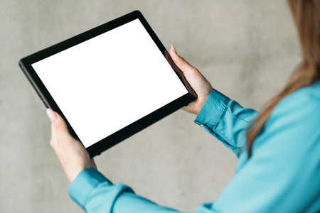 Online training. Digital mockup. Virtual technology. Unrecognizable woman office look holding tablet...