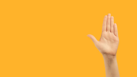 Stop gesture. No sign. Restriction rejection. Raised female hand palm warning with nope enough...