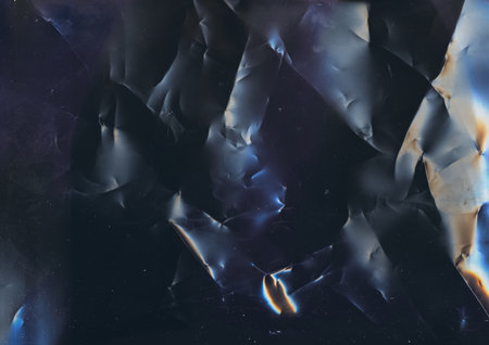 Distressed overlay. Creased texture. Old film. Blue orange noise dust scratches on dark black...