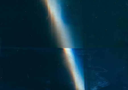 Retro overlay. Old film. Distressed screen. Blue orange light flare stains dust scratches on dark...