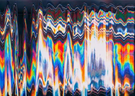 Glitch art. Color distortion. Futuristic noise texture. Neon orange blue green glow wave artifacts on black abstract illustration background.の写真素材
