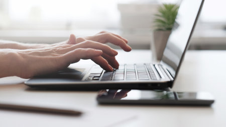 Online work. Digital business. Internet research. Information technology. Side view of hands typing...