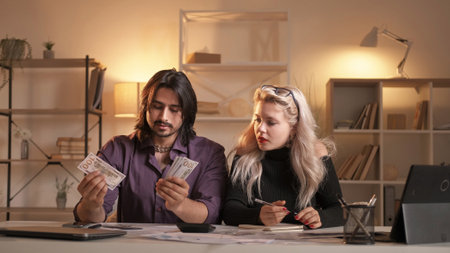Money management. Family budget. Income account. Financial economy. Disturbed diverse couple...