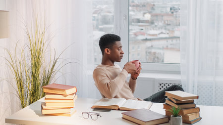 Study break. Enjoying coffee. Comfort relax. Serene calm dreamy man at window drinking mug of tea...