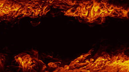 Burning background. Fire heat. Hot blaze. Orange red color light warm flame blast texture frame on dark night black abstract copy space.の写真素材