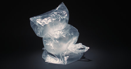 Plastic problem. Ecology pollution. Litter recycling. Empty blown used cellophane bags stack in...