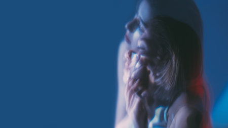 Dreaming face. Neon light people. Double exposure of pensive woman with closed eyes isolated on dark...