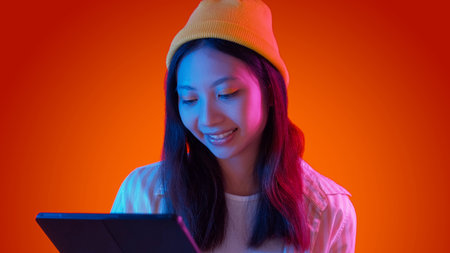Internet surfing. Reading tablet. Hipster woman using modern device typing social media...