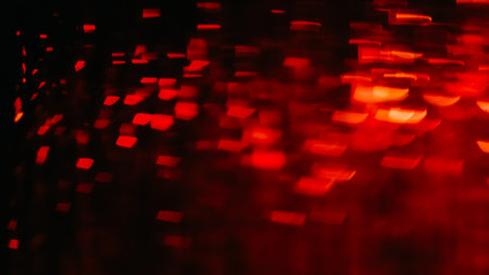 Bokeh light. Color flare. Blur confetti. Festive decor. Defocused red orange led bulbs sparkle glare...