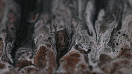 Paint flow glitter blur. Brilliant texture. Gel sparkling particles mixed texture creative background liquid black bubbles abstract art.の写真素材