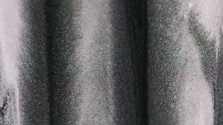 Metallic paint. Glitter ink. Blur gray black silver color flowing shimmer particles dripping...