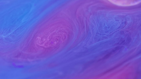 Neon smoke. Ink galaxy. Defocused blue purple violet color mixing gradient paint flowing magic brilliance vapor shimmer oil drop abstract art background.の写真素材