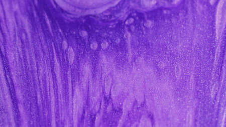 Glowing ink. Shimmer fluid. Defocused purple color spill shiny liquid waving emulsion sparkling...