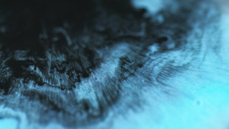 Liquid paint. Sparkling emulsion flow. Cyan black texture blend fluid blue mix ink splash wave abstract hypnotic background design.の写真素材
