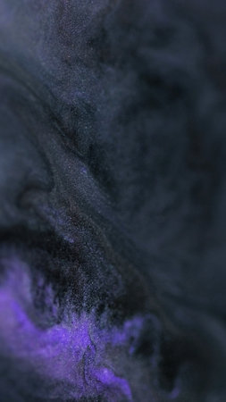 Magic glitter. Ink emulsion. Dark purple blue defocused sparkling liquid mixing black lavender color...