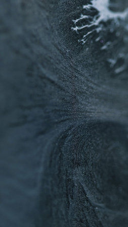 Ink glitter. Blur wave. Mystical paint art. Dark gray mixed white blue sparkling particles texture...