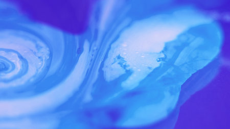 Paint swirl. Bubble fluid. Defocused blue white color oil emulsion texture ink water blend vortex abstract art background.の写真素材