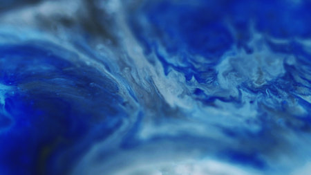 Ink wave. Glitter fluid spill. Defocused blue black color grain particles texture liquid mix flow abstract art background.の写真素材