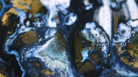 Shiny fluid splash. Paint spill. Blur blue white black golden color glitter particles texture ink...