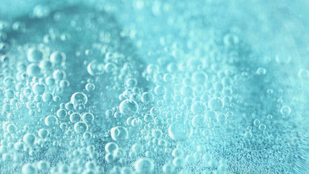 Water bubbles. Oil fluid. Defocused clear blue color fluid swirl wet gloss texture gel emulsion floating abstract art background.の写真素材