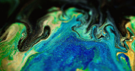 Glitter ink spill. Paint drip. Defocused blue green black color sparkling texture acrylic emulsion...