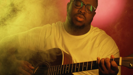 Guitar performer. Music entertainment. Professional artist man playing song chords on acoustic...