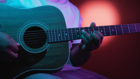 Guitar festival. Music performance. Jazz solo. Talented man hands playing song chords on acoustic...