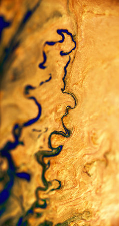 Ink spill. Sparkling fluid drip. Defocused golden yellow blue color shimmering particles texture...
