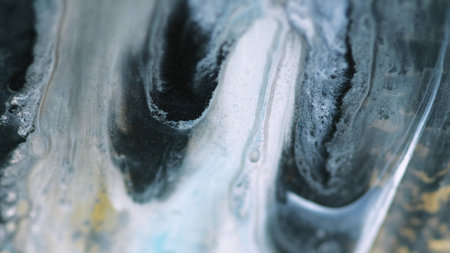 Fluid acryl drip. Glitter ink mix. Defocused white black gray dye oil emulsion shiny particles flow...