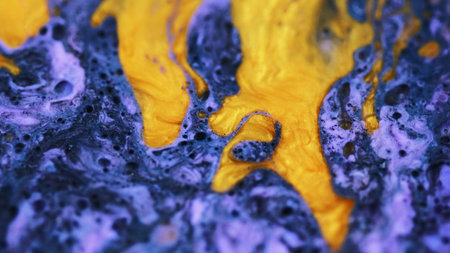Glitter paint spill. Ink drip. Defocused blue golden yellow color shimmering bubble texture oil fluid flow abstract art background.の写真素材