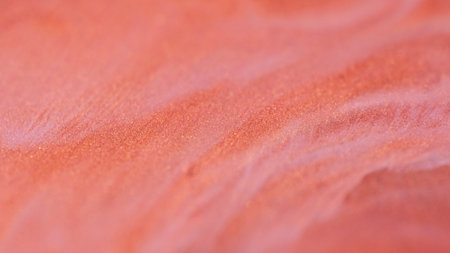 Water glitter mix. Limestone paint. Defocused red white color bright sand particles texture fluid...
