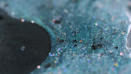 Glitter ink drip. Paint spill. Blur teal black color holographic sequin particles oil shimmer gel...