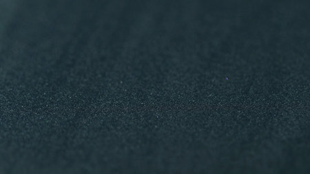 Paint cereal texture. Ink blend. Black blue color gradient shimmer sand particles surface art design with free space on abstract background.の写真素材